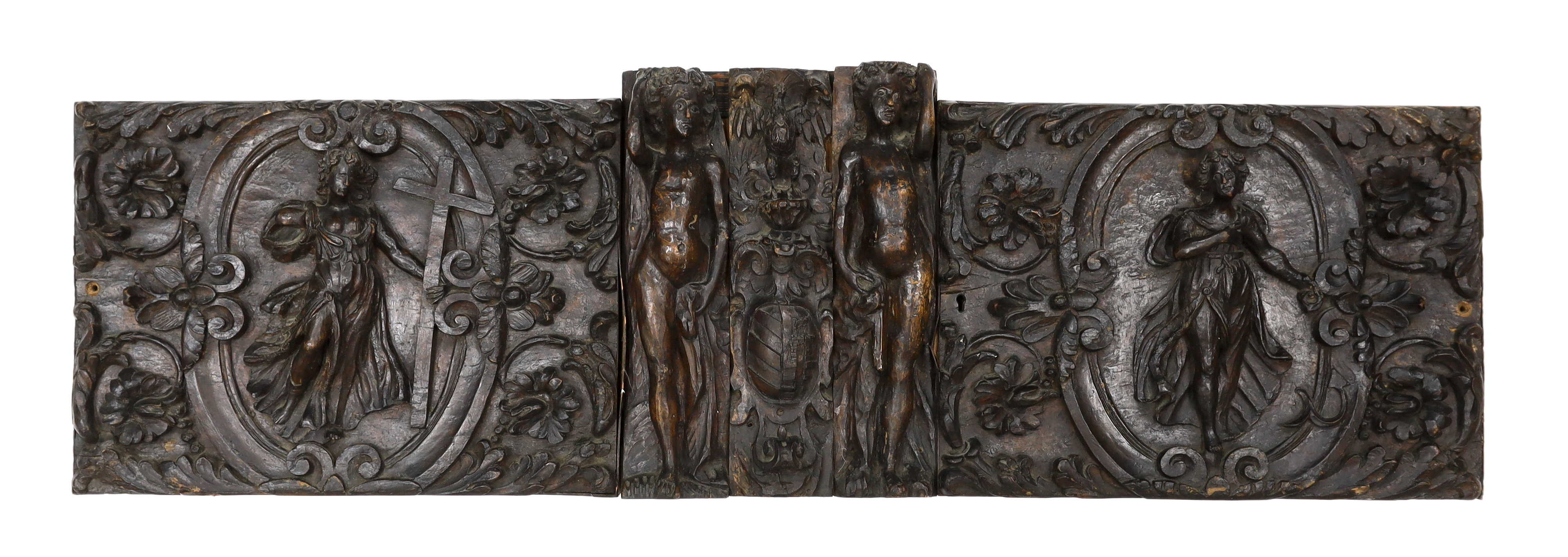 A 17th century French carved walnut triptych panel, 121cm wide, 37cm high